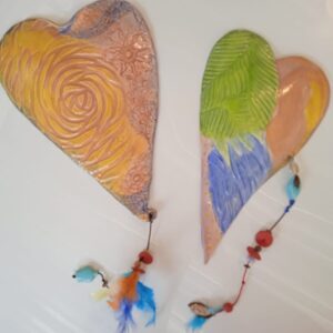 Corazon y plumas by Kim Bagatto